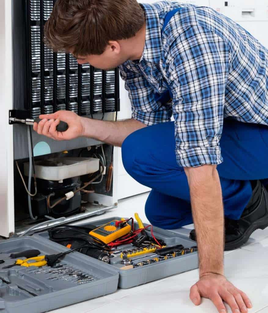 ART Works LLC certified technician repairing home appliance in Dubai